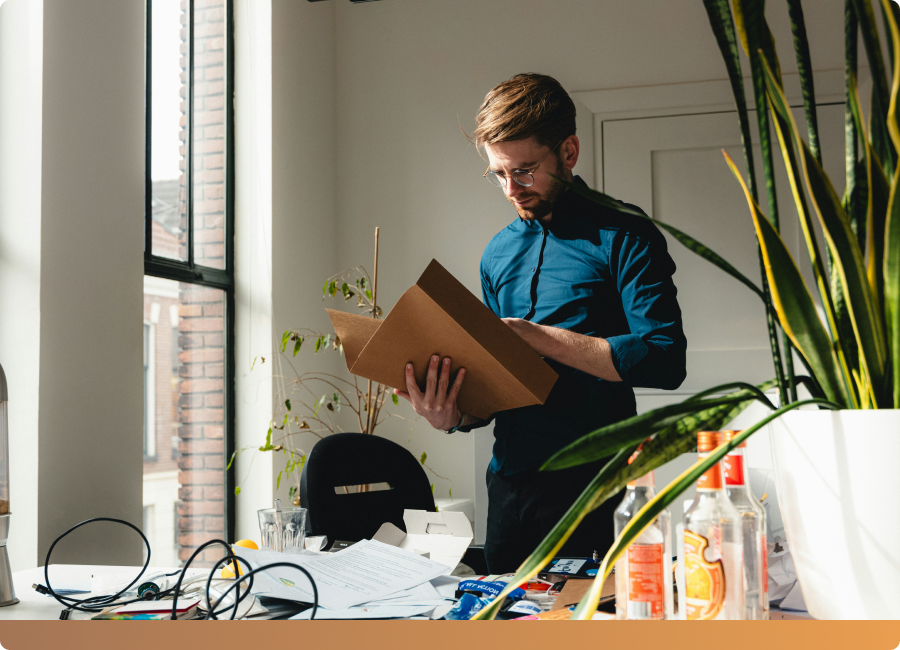 Man holding open his folder with contains the bookkeeping agreement